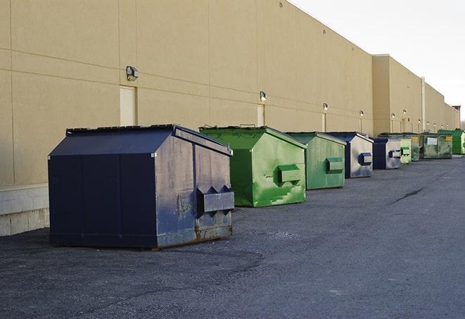 large garbage containers clustered on a construction lot in Prineville, OR